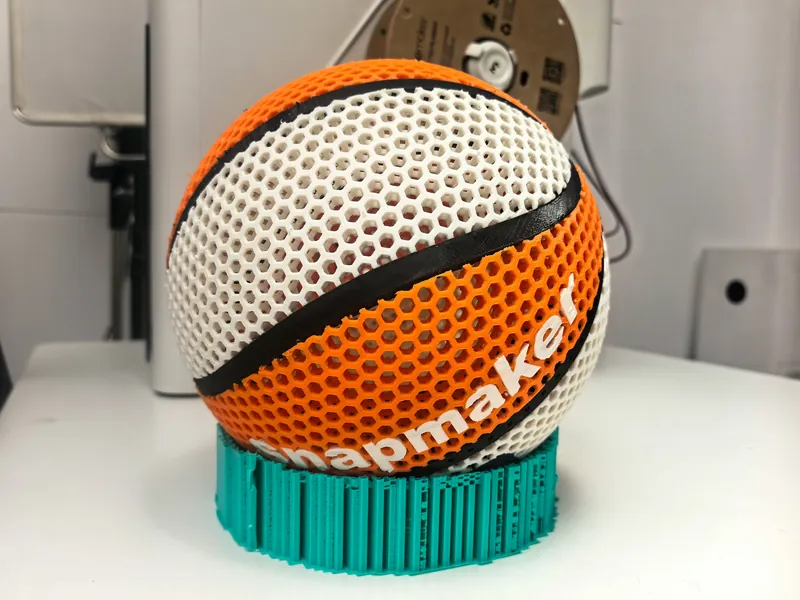Bola de basquete vazada em colmeia, impressa em laranja, branco e preto